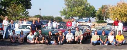Group of CMGC members with their cars