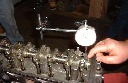 Checking valve overtravel with dial indicator
