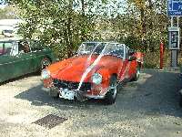 MG Midget wrapped in spider web