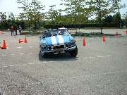 blue MGB running the cones